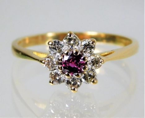 An 18ct gold ring set with diamond and ruby 3g Size O/P