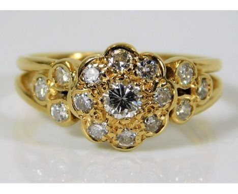 A yellow metal ring tests as 18ct gold set with 1.1ct of diamond 5.5g Size P