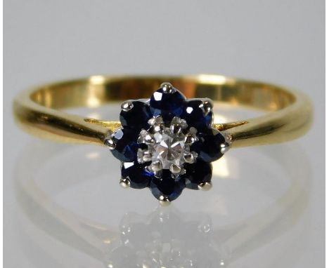 An 18ct gold ring set with diamond and sapphire 2.6g Size N