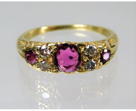 An 18ct antique gold  ring set with diamond and ruby 4.7g Size N
