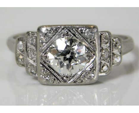 An art deco period platinum ring set with diamonds with an old cut centre diamond of good colour &amp; clarity, of approx. 0.