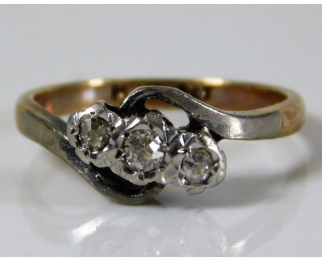 A 9ct gold ring set with with three platinum mounted diamonds 2.5g size J/K