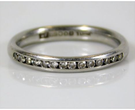 A platinum half eternity ring set with 14 diamonds 3.9g size L