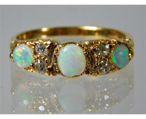 A 15ct gold antique ring set with diamond and opal 3.4g size L