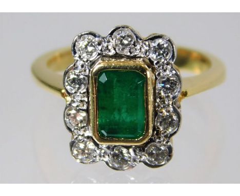  An 18ct gold ring set with emerald and diamonds 4.6g Size G