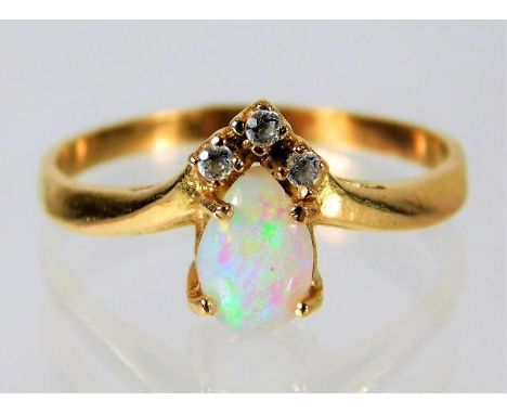 Yellow metal ring tests as 14ct set with diamond and opal 2g size N