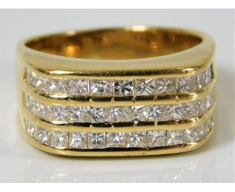 An 18ct gold ring set with 1.5ct princess cut diamonds 10.3g Size Q