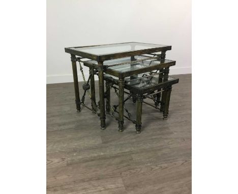 ITALIAN DESIGNER NEST OF THREE TABLES,of Neo-Classical design, gilt metal with glass tops, on fluted supports with arrow moti