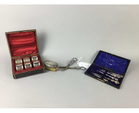 CASED SET OF SILVER HANDLED BUTTON HOOKS AND NEEDLES,along with a silver mounted brush, a set of six silver plated napkin rin