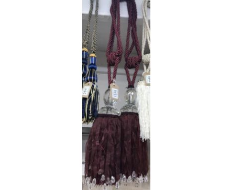 Large red wine and gold curtain tie back with tassel and gem style embellishment