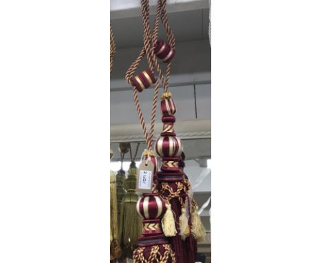 A pair of red wine curtain tie backs with tassel