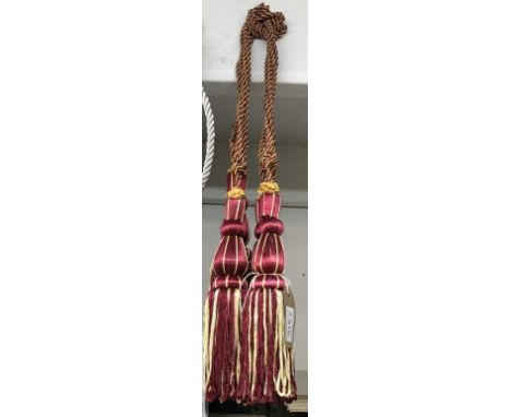 A pair of red wine &amp; gold curtain tie backs with tassels