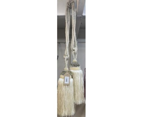 One pair of white curtain tie backs with small gem style embellishment