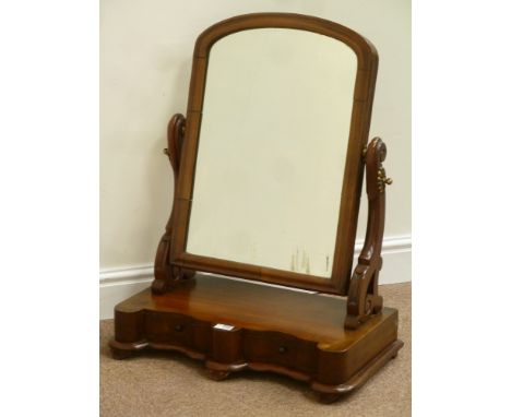 Victorian mahogany serpentine toilet mirror fitted with two trinket drawers, carved mirror supports, W61cm