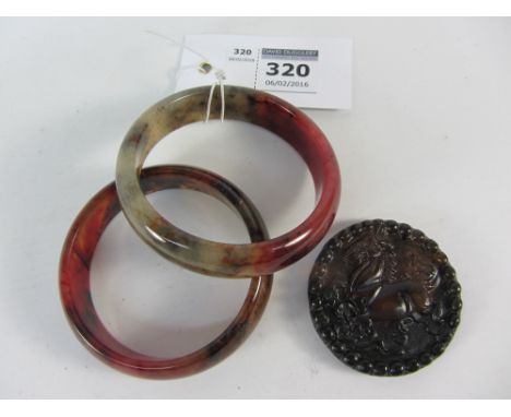 Two jade bangles and a jade pendant D5.5cm (3) 