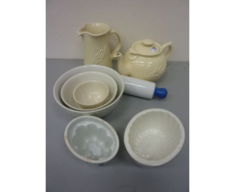 Large AGA teapot and jug, set of three Burleigh graduated mixing bowls, two jelly moulds and a ceramic rolling pin