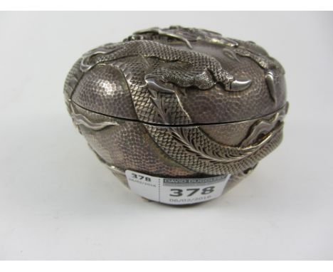 Chinese beaten silver double skinned circular lidded trinket box with raised dragon decoration overall marks to base 10cm dia