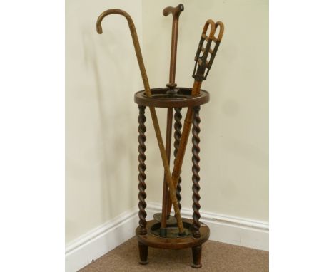 Early 20th century oak barley twist stick stand, bamboo shooting stick and two other sticks, H72cm