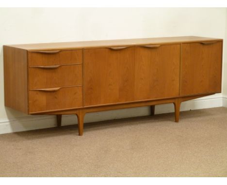 McIntosh vintage retro teak sideboard fitted with centre double cupboard, three drawers to the left and fall front cupboard t