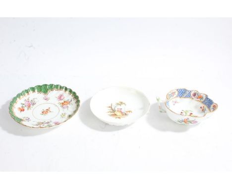 A 19th century leaf-shape butter boat, baring Meissen marks, with a blue fish scale border and floral panels and a courting c