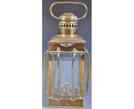 A antique late 19th / early 20th Century English hanging porch / hall lantern of brass construction having and hanging / carr