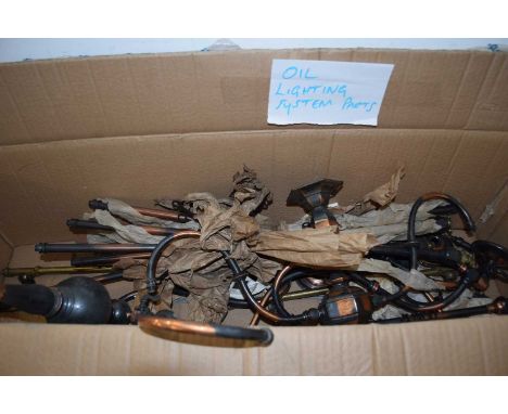 BOX CONTAINING VARIOUS PARTS FOR AN OIL LIGHTING SYSTEM
