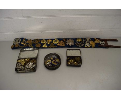 BAG CONTAINING QUANTITY OF OLD TINS AND MILITARY BADGES AND BELT CONTAINING A QUANTITY OF BRITISH ARMY REGIMENT BADGES