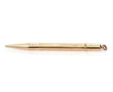 Vintage 9ct gold mechanical hallmarked pencil, the barrel engraved with a wavey line design and hallmarked for London 1946, m