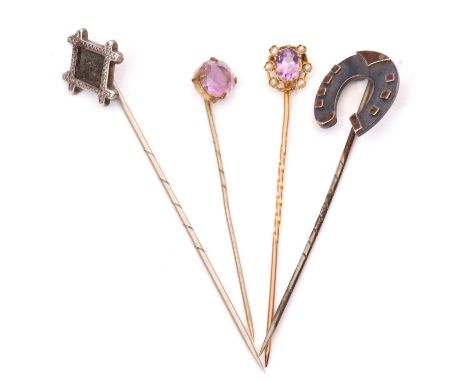 Group of four stick pins to include amethyst and seed pearl cluster finial, a horseshoe example and two others (unmarked)