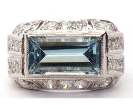 Art Deco oblong light blue stone ring in cut down setting and raised above a diamond mount set with graduated old cut small d