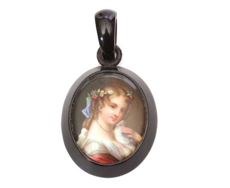 Vintage jet porcelain pendant, the oval pendant set with a hand painted porcelain panel, depicting a head and shoulders profi