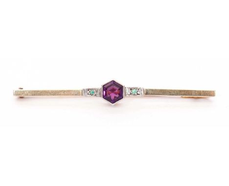  Amethyst and Emerald set brooch, the hexagonal cut amethyst flanked by two small emeralds, 5cm long stamped 9ct &amp; sil se