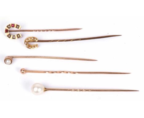 Five stick pins to include 9ct gold horseshoe example set with small seed pearls, a garnet and ruby, hallmarked for Chester 1