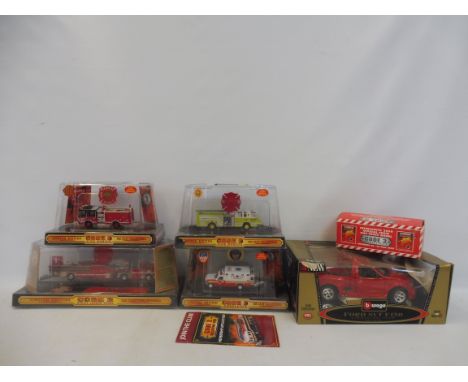 A selection of die-cast code 3 fire rescue trucks, and a Burago 1:21 scale model.