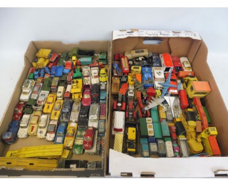 Two large trays of playworn die-cast models to include Dinky, Corgi, Lesney etc.
