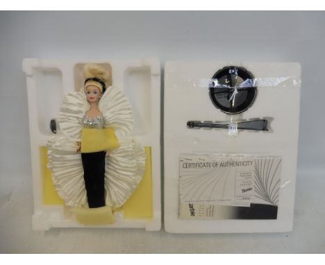 A boxed Mattel Crystal Rhapsody porcelain doll, in trade pack, excellent condition.