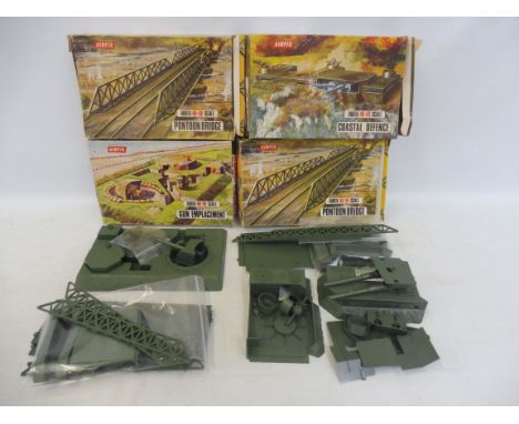 Four boxed Airfix ho/oo scale kits, gun emplacement, two pontoon bridges and coastal defence.