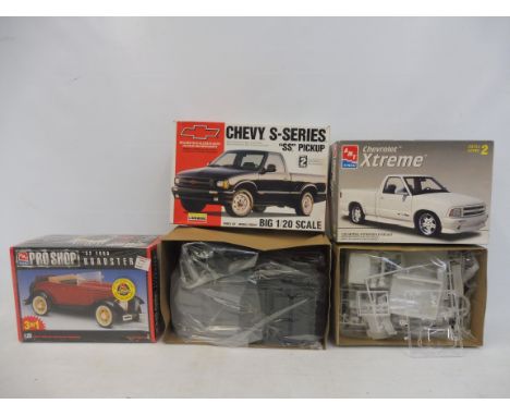 Three boxed 1:25 scale AMT plastic model kits, contents unchecked, but appear sealed, to include a 1932 Ford Roadster.