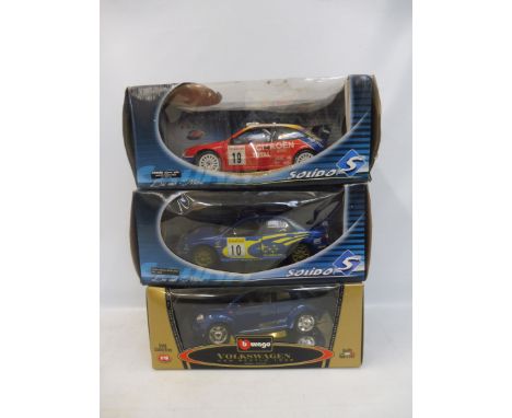 Three 1:18 scale boxed models to include Subaru Imprezza and others.