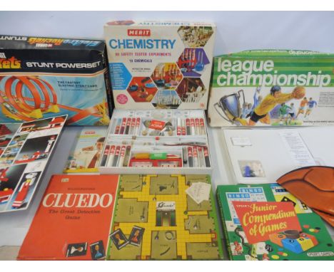 A selection of period games together with a 1970s Lego System and Corgi rockets.