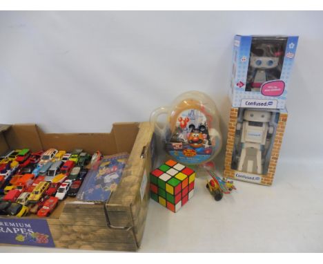 A mixed box of toys to include die-cast models, a Mr Potato Head, large scale Rubix Cube and others.