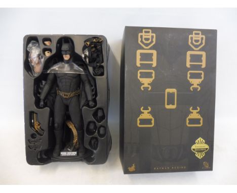 A Batman Begins DC Comics Bruce Wayne collectors' figure.