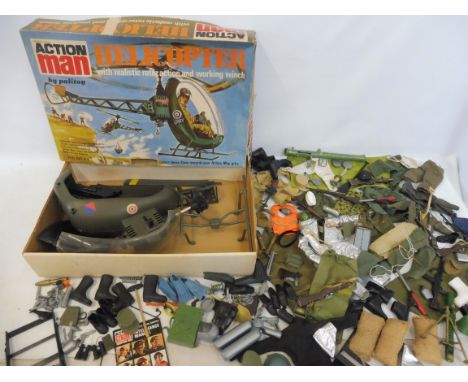 Action Man - a boxed helicopter and a quantity of accessories, guns etc.