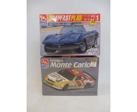 Two boxed 1:25 scale AMT plastic model kits, performance cars, to include The Kelloggs Monte Carlo.