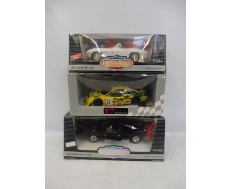 Three 1:18th scale models, to include two American muscle cars.