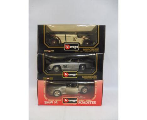 Three boxed 1/18 scale Burago models, two Mercedes and one BMW.