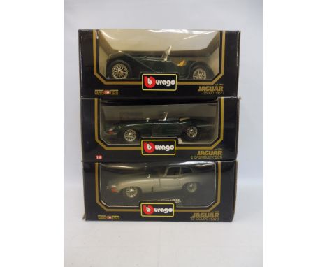 Three boxed Burago 1/18 scale models, all Jaguars of different eras.