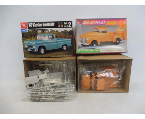 Two boxed 1:25 scale AMT plastic model kits, to include a 1950 Chevy.