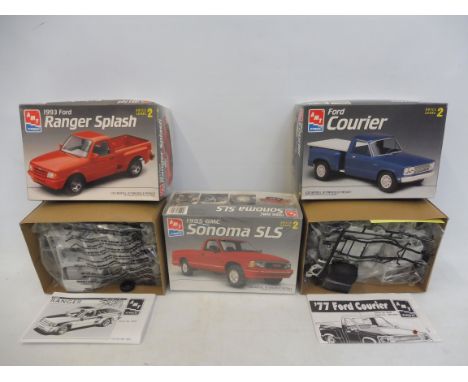 Three boxed 1:25 scale AMT plastic model kits, contents unchecked, but appear sealed, including a Ford Ranger and Courier.