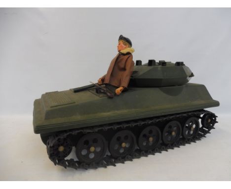 An Action Man tank and a flocked 1970s Action Man figure.